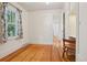 Bright bedroom with hardwood floors, a large window and closet space perfect for a starter room at 4465 S Bannock St, Englewood, CO 80110