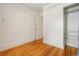 Empty bedroom with closet space and hardwood floors, awaiting your personal touch at 4465 S Bannock St, Englewood, CO 80110
