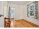 Cozy bedroom with hardwood floors, natural light, and patterned curtains at 4465 S Bannock St, Englewood, CO 80110