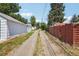 View of the long gravel driveway to the back of the property at 4465 S Bannock St, Englewood, CO 80110