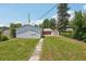 Detached garage with white siding, side yard access, and ample storage at 4465 S Bannock St, Englewood, CO 80110