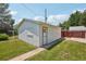 Detached garage with white siding, offering parking and storage space at 4465 S Bannock St, Englewood, CO 80110