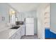 Efficient kitchen showcases classic cabinets, stainless steel appliances, and opens to dining area at 4465 S Bannock St, Englewood, CO 80110