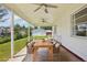 Covered patio with ceiling fans, perfect for outdoor dining and relaxation at 4465 S Bannock St, Englewood, CO 80110