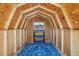 Storage shed's interior features wood framing, window, shelving and a blue carpet at 4465 S Bannock St, Englewood, CO 80110