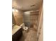 Bathroom with a shower and tile surround, toilet, and vanity with sink at 5971 S Tabor St, Littleton, CO 80127