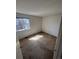 Bright bedroom with a large window offering natural light and plush carpeting at 5971 S Tabor St, Littleton, CO 80127