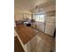 Functional kitchen featuring light cabinets, laminate countertops, and standard appliances at 5971 S Tabor St, Littleton, CO 80127