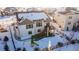 Aerial view of house showcasing backyard, deck, and playground in a snowy setting at 23579 E Swallow Cir, Aurora, CO 80016