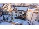 Aerial view of house showcasing backyard, deck, and playground in a snowy setting at 23579 E Swallow Cir, Aurora, CO 80016