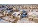 Aerial view of a two-story house with a snow-covered yard, in a neighborhood setting at 23579 E Swallow Cir, Aurora, CO 80016