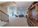 Spacious finished basement with carpet flooring and stylish built-in entertainment center, perfect for Gathering gatherings at 23579 E Swallow Cir, Aurora, CO 80016