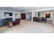 Expansive basement featuring a wet bar, media area, and open layout for versatile entertaining and relaxation at 23579 E Swallow Cir, Aurora, CO 80016