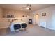 Well-lit bedroom with neutral walls, ceiling fan, and plush carpeting creating a relaxing and inviting atmosphere at 23579 E Swallow Cir, Aurora, CO 80016