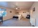 Basement bedroom with a queen-size bed and seating area at 23579 E Swallow Cir, Aurora, CO 80016