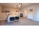 Cozy bedroom with neutral walls, carpet, ceiling fan and comfortable seating at 23579 E Swallow Cir, Aurora, CO 80016