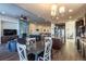 Kitchen features a large island and breakfast bar, adjacent to a dining area at 23579 E Swallow Cir, Aurora, CO 80016