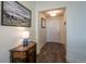 Bright entryway with wood-look floors and white shiplap walls at 23579 E Swallow Cir, Aurora, CO 80016