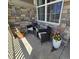 Inviting front porch with seating, planters, and stone facade at 23579 E Swallow Cir, Aurora, CO 80016
