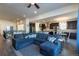 Bright open living room with comfortable seating and open access to the kitchen and dining area at 23579 E Swallow Cir, Aurora, CO 80016