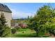 Exterior backyard view with green space and views of the distant mountains and neighboring homes at 9188 W Ontario Dr, Littleton, CO 80128