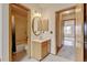 Cozy bathroom features a shower and tub combination with a single sink vanity and great natural light at 9188 W Ontario Dr, Littleton, CO 80128