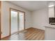 Bright dining area with sliding glass door and wood-look flooring, providing access to outdoor space at 9188 W Ontario Dr, Littleton, CO 80128