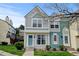 Beautiful two-story townhome showcasing an attractive facade and well-maintained landscaping at 9188 W Ontario Dr, Littleton, CO 80128