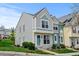Inviting two-story townhome featuring lush lawn, landscaped yard and colorful exterior finishes at 9188 W Ontario Dr, Littleton, CO 80128