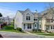 Charming townhome featuring two-story facade with landscaped yard and colorful exterior finishes at 9188 W Ontario Dr, Littleton, CO 80128