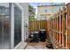 Private patio space features a wooden fence and a sliding glass door entry at 9188 W Ontario Dr, Littleton, CO 80128