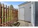 Private patio with wooden fence and access to additional storage space at 9188 W Ontario Dr, Littleton, CO 80128