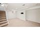 Partially finished basement space with carpeted stairs leading down to it at 4945 Perry St, Denver, CO 80212