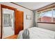 Bedroom view into kitchen with hardwood floors, natural light, and a smooth transition between spaces at 4945 Perry St, Denver, CO 80212