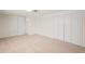 Spacious carpeted bedroom featuring ample closet space for storage at 4945 Perry St, Denver, CO 80212