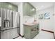 Well-organized butler's pantry with ample storage, wine cooler, and a convenient counter for serving and preparation at 4945 Perry St, Denver, CO 80212
