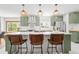 Stylish kitchen with white subway tile backsplash, stainless steel appliances, and a central island with seating at 4945 Perry St, Denver, CO 80212