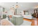 Modern kitchen island features a copper sink, ample counter space, and stylish pendant lighting at 4945 Perry St, Denver, CO 80212