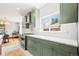 Modern kitchen featuring stainless steel appliances, subway tile backsplash, and ample countertop space at 4945 Perry St, Denver, CO 80212
