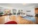 Bright, open floor plan combines living, dining, and kitchen areas, showcasing hardwood floors and modern finishes at 4945 Perry St, Denver, CO 80212