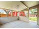 View of covered patio with open windows and backyard view at 4945 Perry St, Denver, CO 80212