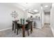 Cozy dining area with modern chandelier and seating for four at 12558 E Tennessee Cir, Aurora, CO 80012