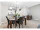 Cozy dining area features stylish light fixture and blends into the kitchen at 12558 E Tennessee Cir, Aurora, CO 80012