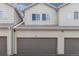 View of garages of the apartment complex with visible unit numbers at 12558 E Tennessee Cir, Aurora, CO 80012