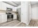 Contemporary kitchen with stainless steel appliances, and a breakfast bar at 12558 E Tennessee Cir, Aurora, CO 80012