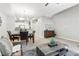 Open-concept living area with modern furnishings and a cozy dining space at 12558 E Tennessee Cir, Aurora, CO 80012