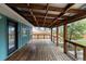 Large back deck with wooden beams and railings, perfect for outdoor entertaining at 610 E Baseline Rd, Lafayette, CO 80026