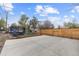 Spacious backyard featuring a large concrete patio, new wood fence, and convenient alley access at 610 E Baseline Rd, Lafayette, CO 80026