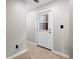 Basement hallway with door to exterior at 610 E Baseline Rd, Lafayette, CO 80026