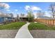 Charming home with a well-manicured front yard, inviting walkway, and cozy covered porch at 610 E Baseline Rd, Lafayette, CO 80026